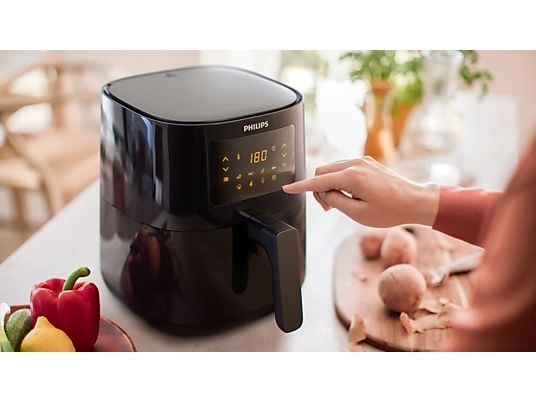 De Ninja Airfryer MAX PRO bakt frietjes met hete lucht en slechts een klein beetje olie, waardoor ze goudbruin en krokant worden zonder overtollig vet.